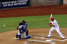 A wild pitch goes past the catcher. Wild pitch (9331552726).jpg