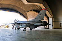 Members of the 332d Expeditionary Aircraft Maintenance Squadron (EAMXS), place an F-16C+ Fighting Falcon from the 119th Expeditionary Fighter Squadron, New Jersey ANG back in a hardened aircraft shelter at Joint Base Balad, Iraq on 4 May 2010 119th Fighter Squadron - F-16 Iraq.jpg