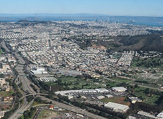 Aerial view of Colma, facing north; 280 Metro Center is in the lower center, adjacent to Woodlawn (to the north) and Greenlawn (to the east) 280 Metro Center.jpg