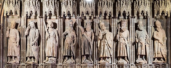 The 14th-century carving "Nine Good Heroes" (known as "Neun Gute Helden" in the original German) at City Hall in Cologne, Germany, is the earliest kno