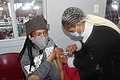 A factory worker in Lesotho receives vaccine.jpg