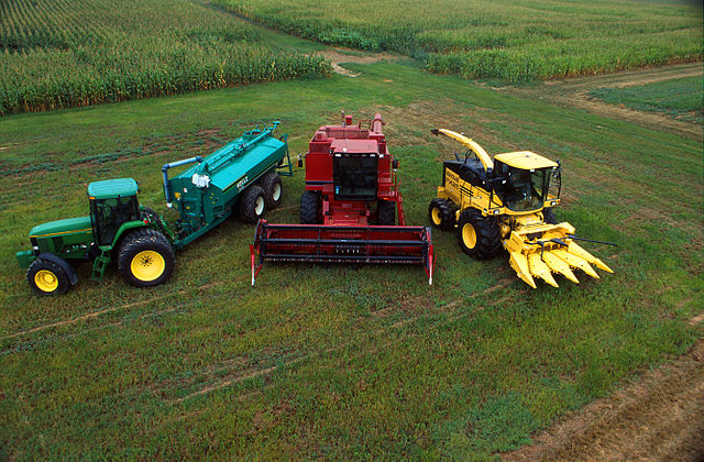 Agribusiness: a display of a John Deere 7800 tractor with Houle slurry trailer, Case IH combine harvester, New Holland FX 25 forage harvester with cor