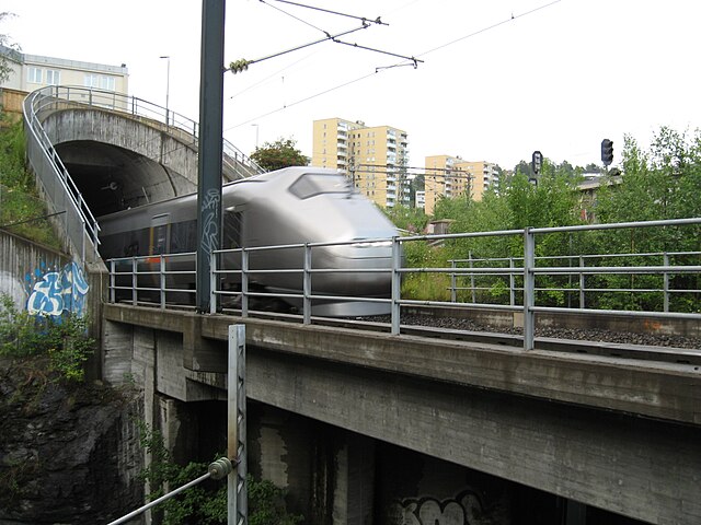 An Airport Express Train emerges from the Romeriksporten railway tunnel at Etterstad in 2009