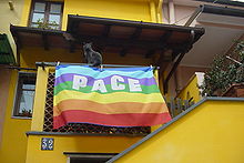 The peace flag flown from a balcony in Italy Bandiera pace.jpg
