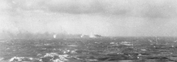 Battleship Bismarck burning and sinking 1941.jpg
