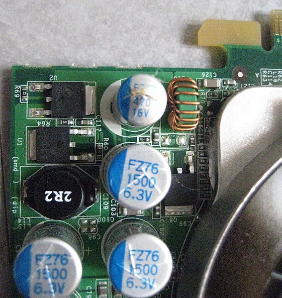 File:Blown capacitor on video card.jpg