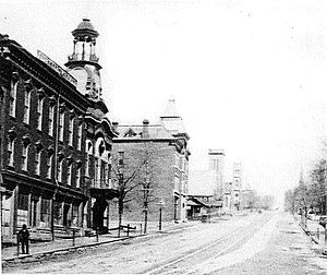 The Clarissa C. Cook Library is the third building on the left in this 1880 photograph. Brady Street Davenport 1880.jpg