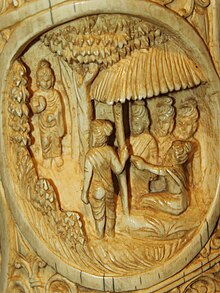 Buddha visiting his five old friends Roundel 26 buddha ivory tusk.jpg