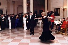John Travolta dances with Diana, Princess of Wales in the Entrance Hall at a 1985 dinner for the Prince of Wales during the administration of Ronald Reagan C31900-22.jpg