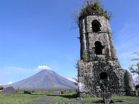 The tower is what remains of the Cagsawa Church, which was buried by the 1814 eruption of Mayon Volcano. CAGSAWA RUINS.jpg