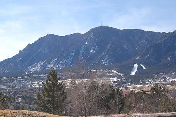 Cheyenne Mountain, as seen from I-25 near Fort Carson. Note the communications antennas at the summit, which are radio antennas for stations broadcast