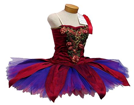A colourfully decorated classical ballet tutu, on a dress form
