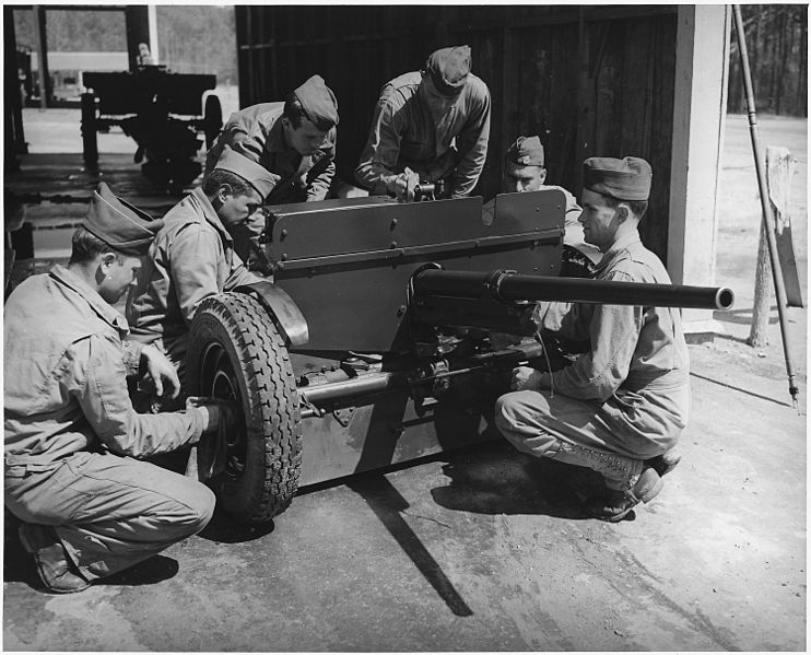 File:Crew of 37mm. anti-tank gun, in training at Fort Benning, Georgia, clean and adjust their weapon. - NARA - 196275.jpg