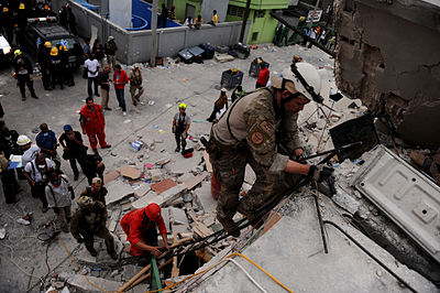 A PJ from the 23rd STS searching for survivors of the 2010 Haiti earthquake in Port-au-Prince