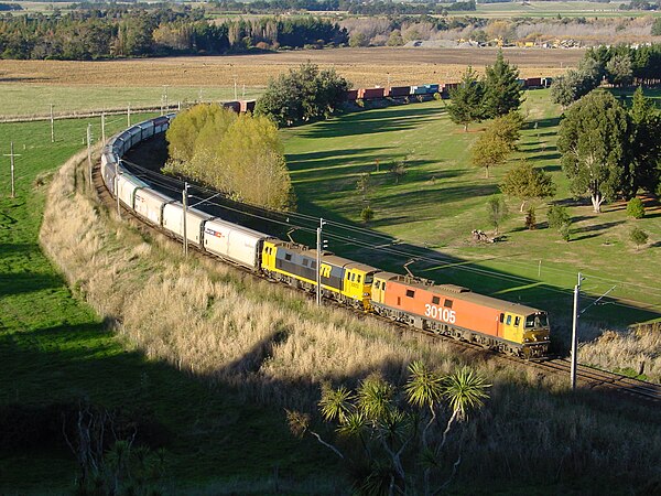 Fruit Salad and Bumble Bee liveried EF class locomotives about to climb the bank.