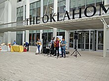 A band plays outside The Oklahoman's Oklahoma City headquarters. Exterior of The Oklahoma's Downtown Oklahoma City Headquarters.jpg