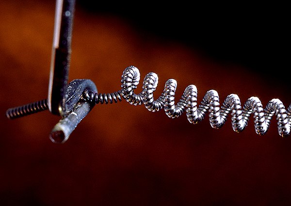 Filament of a 200 watt incandescent lightbulb highly magnified