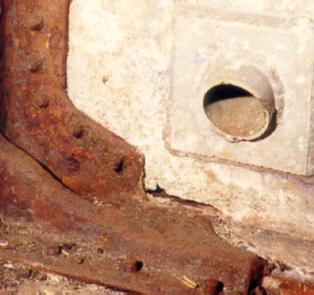 Galvanic corrosion of an aluminium plate occurred when the plate was connected to a mild steel structural support.