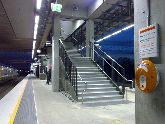 Recently upgraded platforms 1 and 2 of Glenfield station, with stairways leading to an overhead concourse.