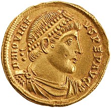 Golden coin depicting man with diadem facing left