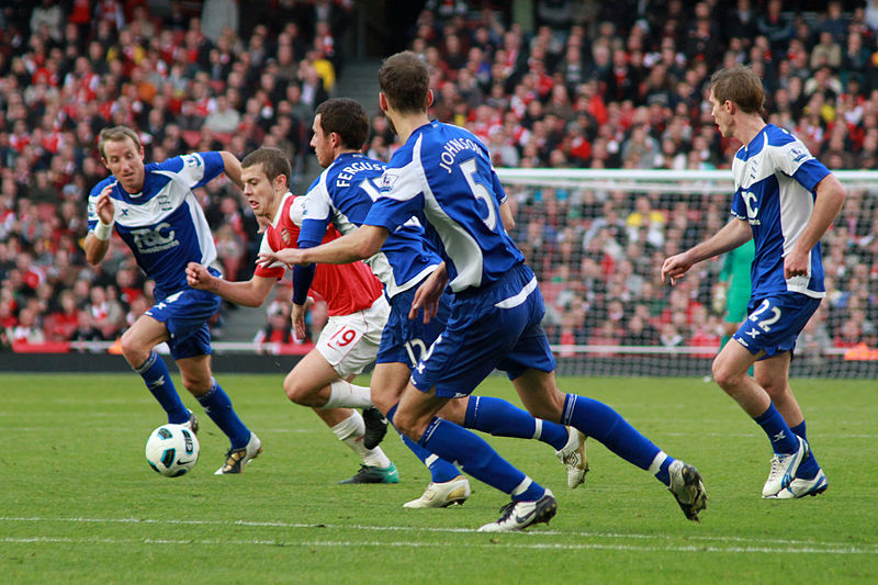 File:Jack Wilshere breaks through the defense (1) (5092283927).jpg