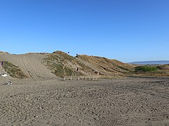 Laoag Sand Dunes sign distant