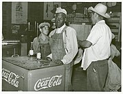 Mexican and negro cotton pickers inside plantation store, Knowlton Plantation, Perthshire, Miss. Delta. This transient labor is contracted for and brought in trucks from Texas each season