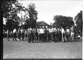 Miami University freshman-sophomore tug-of-war participants carrying rope through Oxford 1922 (3190622753).jpg