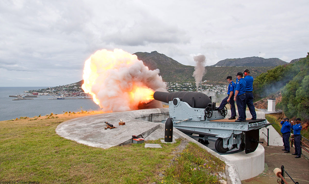 Restored Mark I, RML 9 inch 12 ton gun being fired at Simon's Town in 2014, with replica ammunition in the foreground Photograph: ShaneCaptHaddockSwartz Licensing: CC-BY-SA-3.0