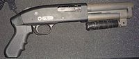 The Serbu Super-Shorty pump-action shotgun, manufactured without a buttstock, is an AOW smooth-bore handgun, not an SBS. My Serbu.jpg