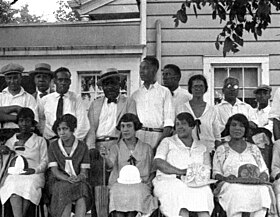 "National Colored Tournament" Shot at the Shady Rest Golf and Country Club in Scotch Plains, New Jersey, the frame shows members of the nation's first African-American golf club posing for Fox News on July 12, 1925. National Colored Tournament, Shady Rest CC, July 1925.jpg