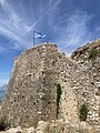The Greek flag flying from the highest point in the fortress