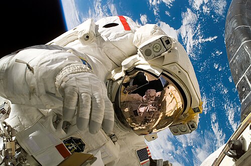 Astronaut Piers Sellers during the third spacewalk of STS-121, a demonstration of orbiter heat shield repair techniques