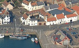 Aerial view of the museum complex, with the twin masted Reaper seen berthed in the harbour to the left. Scottish Fisheries Museum.jpg