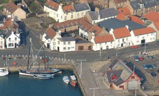 Aerial view of the museum complex, with the twin masted Reaper seen berthed in the harbour to the left.