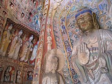 Statues of the Yungang Grottoes, one of many cultural symbols displaying China's embracement of Buddhism. Side wall statues Yungang.jpg