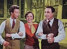 Donald O'Connor, Debbie Reynolds, and Gene Kelly from a lobby card for Singin' in the Rain Singin' In The Rain Lobby Card 1 (cropped).jpg