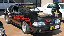 A Ford Mustang D.A.R.E. vehicle used by the Stark County Sheriff's Office Stark County Sheriff Ford Mustang DARE (50229503913).jpg