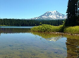 Takhlakh Lake reflects Mount Adams near the day use area at Takhlakh Lake Campground.