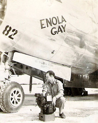 Bombardier Thomas Ferebee with the Norden Bombsight on Tinian after the dropping of Little Boy