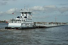 The towboat Angelina pushes two loaded barges in New Orleans. TowboatAngelina-NOLA.jpg