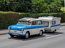 A Trabant P 50 pulling a caravan. Its paintwork is typical of the 1960–1962 models