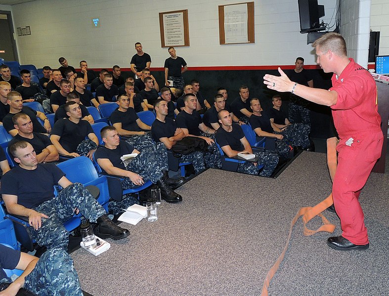 File:U.S. Navy Quartermaster 2nd Class Michael Wignall, a facilitator in the USS Chief (MCM 14) Fire Fighting trainer at Recruit Training Command, instructs recruits on hose handling at Naval Station Great Lakes 120629-N-IK959-690.jpg