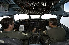 The cockpit of a C-9B Skytrain US Navy 050909-N-5328N-358 U.S. Navy Cmdr. James McSweeney, and Cmdr. Robert Velez, pilot a C-9 Skytrain cargo plane from the Hurricane Katrina staging area at Sherman Field aboard Naval Air Station Pensacola.jpg