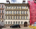 Apartment house in half-open development and courtyard paving