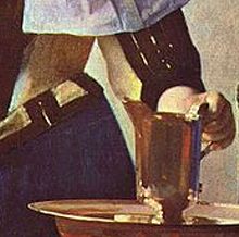 Detail of Woman with a Water Pitcher, by Johannes Vermeer, showing yellow bodice becoming a mixture of purple and orange-yellow in shadow between waist and arms from reflected light. Vermeer detail of Woman with Pitcher.jpg