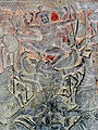 12th century bas relief at Angkor Wat in Cambodia showing Vishnu in battle mounted on Garuda