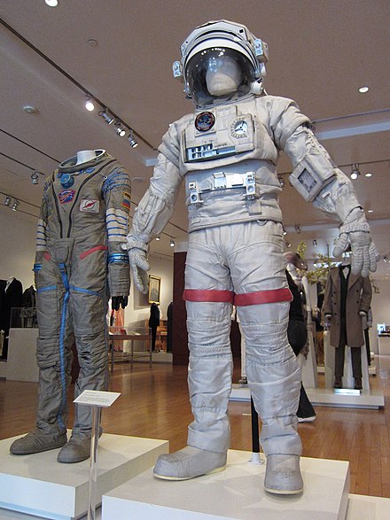 Costumes worn by Sandra Bullock (left) and George Clooney (right) and designed by Jany Temime