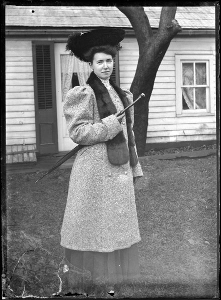 File:Woman with umbrella under her arm (I0013299).tif