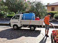 Watering plants by hand